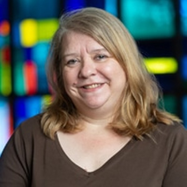 Woman in church with brown shirt